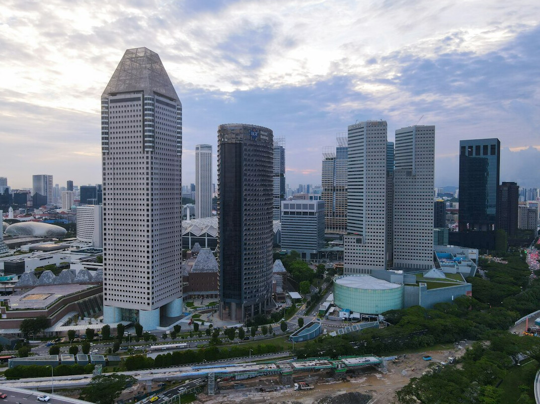 Modern glass office towers in Singapore's business district skyline