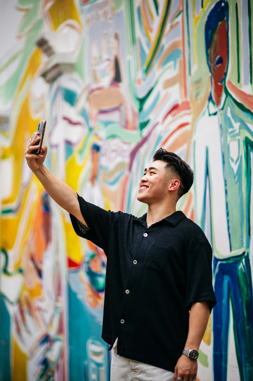 Studio portrait of a Malay Singaporean man design lead smiling