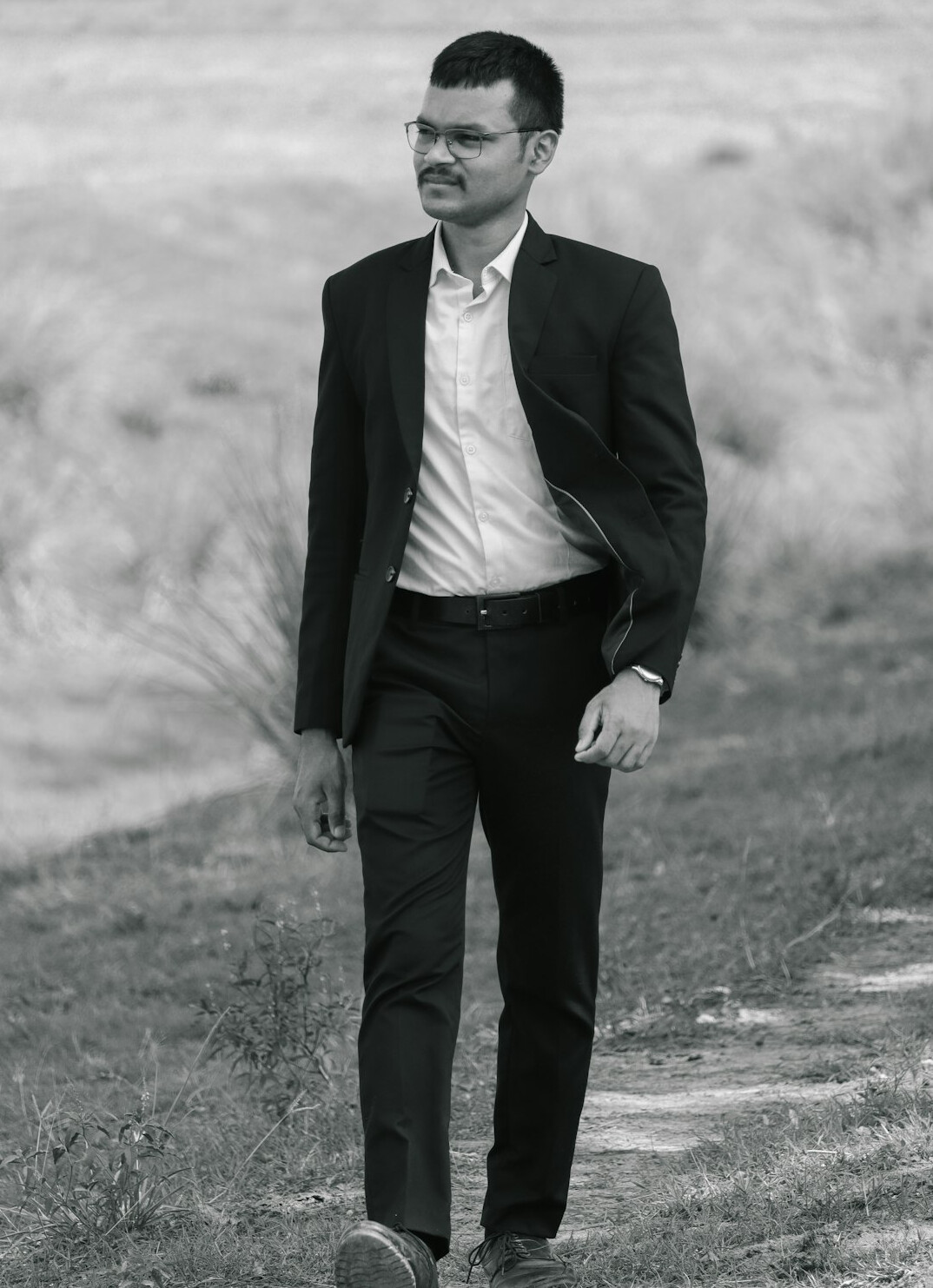 Studio portrait of a Chinese Singaporean man in business attire smiling
